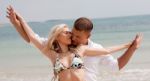 Young Romantic Couple At Beach Stock Photo