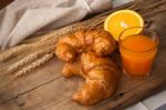 Tasty Croissant And Orange Juice Still Life Rustic Stock Photo