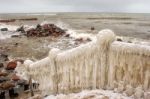 Ice Covered Staircase On The Beach Stock Photo