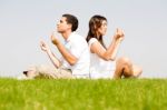 Young Couple Doing Meditation Stock Photo