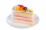 Slice Of Beautiful Cake With Fresh Fruits. Isolated On White Stock Photo