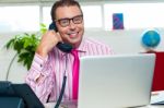 Happy Executive Engaged On A Business Call Stock Photo