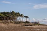 Beach And Cliffs In Quarteira Stock Photo