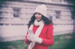 Beautiful Woman In Red Coat And Wool Cap And Gloves With Smartph Stock Photo