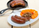 Beef Sausages Cooked On Iron Skillet Stock Photo