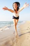 Happy Smiling Girl On The Beach Stock Photo