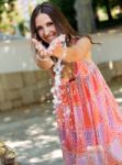 Beautiful Girl Playing With Water In The Garden Stock Photo