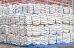 Stacked Sacks Of Meal In Warehouse Waiting For Transportation Stock Photo