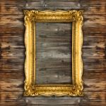 Old Gold Picture Frame On Wooden Background Stock Photo