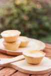 Mini Pies On Wooden Plate Stock Photo