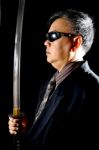 Business Man Holding Sword Stock Photo