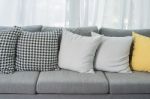 Yellow And Grey Pillows On Modern Sofa Stock Photo