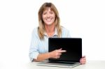 Female Representative Presenting New Laptop Stock Photo