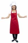 Female Chef Showing Welcome Gesture Stock Photo