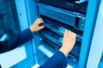 Man Fix Server Network In Data Center Room Stock Photo