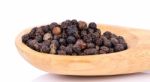 Black Pepper On Wooden Spoon On  White Background Stock Photo