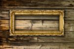 Big Old Gold Picture Frame On Wooden Background Stock Photo