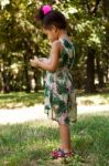 Young Child Using Smartphone At Park Stock Photo