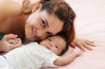 Portrait Of Happy Woman With Her Baby Stock Photo