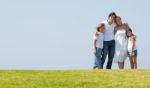 Happy family relaxing in garden Stock Photo