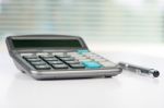 Calculator On A White Table Stock Photo