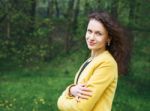 Portrait Of A Beautiful Young Woman In The Park Stock Photo