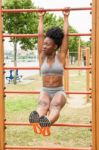 Young African Woman Doing Sit-ups Stock Photo