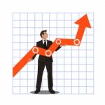 Young Businessman Holding Arrow Going Up. Successful Businessman With Growth Graph Stock Photo