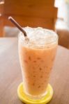 Glass Of Iced Thai Milk Tea Stock Photo