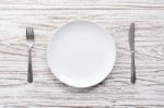 Empty Plate Fork Knife Silverware White Wooden Table Background Stock Photo