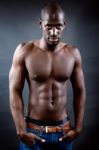 Beautiful And Muscular Man In Dark Background Stock Photo