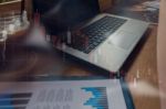 Businessman Is Working With His Computer In Coffee Shop With Sto Stock Photo