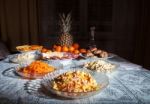 Festively Laid Table With Salads At Night Stock Photo