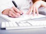 Lady Writing On Notebook Stock Photo