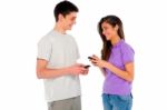 Smiling Couple Holding Smartphone Stock Photo