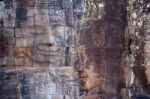 Ancient Stone Face Of Bayon Temple Stock Photo