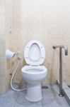 White Lavatory With Hand Rail Stock Photo