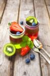 Red And Green Jelly Served With Fruit Stock Photo