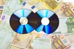 Compact Disks With Euro Money Stock Photo