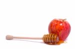 Apple With Honey Dipper Stock Photo