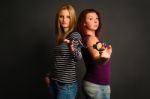 Two Young Women With Handcuffs Stock Photo