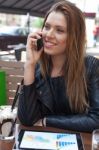 Young Woman Enjoying At Cafe Stock Photo