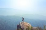 Instagram Filter Young Man Asia Tourist At Mountain Is Watching Over The Misty And Foggy Morning Sunrise, Travel Trekking Stock Photo