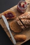 Dark Multigrain Bread Whole Grain And Jam Fresh Baked On Rustic Closeup Stock Photo