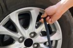 Inflating The Automobile Wheels Via A Pump Stock Photo