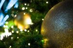 Close Up Big Yellow Glitter Ball Christmas On Tree With Wire White Light Background Stock Photo