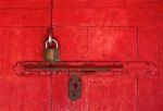 The Old Master Key And Old Bolt On Red Wooden Door Stock Photo