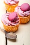 Pink Berry Cream Cupcake With Macaroon On Top Stock Photo