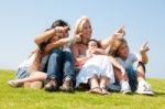 Happy Family Relaxing In Garden Stock Photo