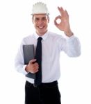 Smiling Engineer Showing Ok Gesture Stock Photo